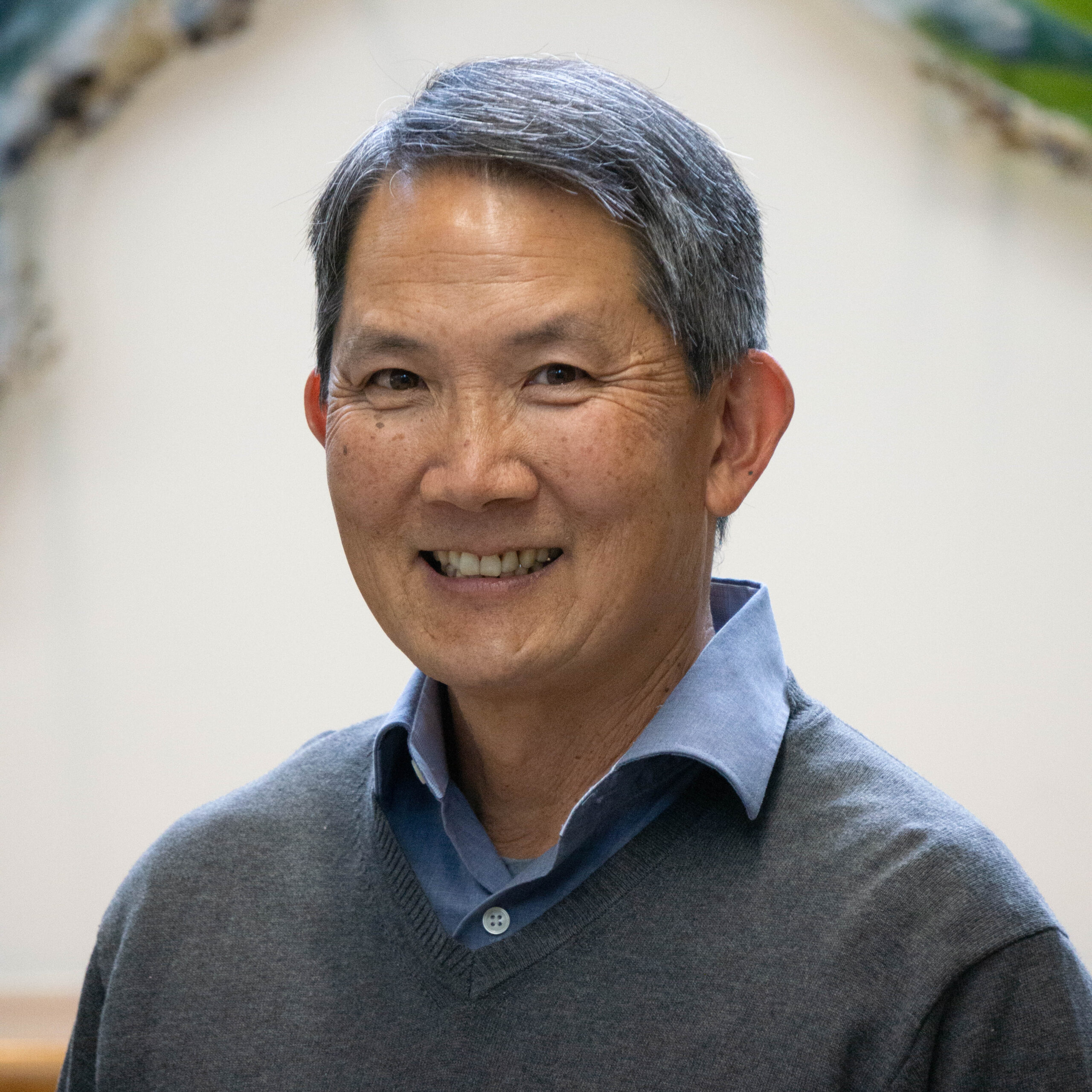 A headshot of board member Jonathan Jue